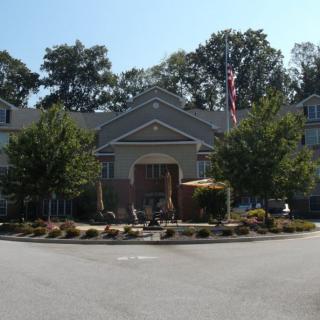 Front view of a residential building with landscaping