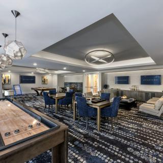 A modern lounge area with stylish furniture and lighting.