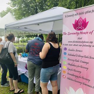 Attendees explore wellness services at a community event.