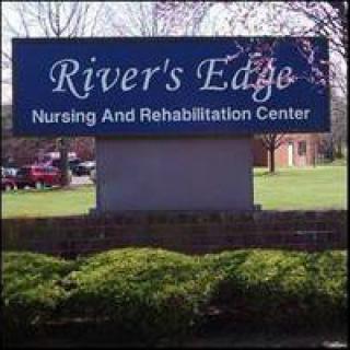 Sign for River's Edge Nursing and Rehabilitation Center outdoors.