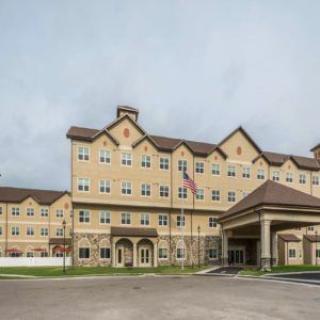 A multi-story hotel building with a prominent entrance.