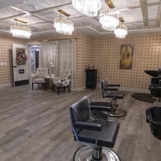 A stylish and modern hair salon featuring elegant decor and comfortable styling chairs.