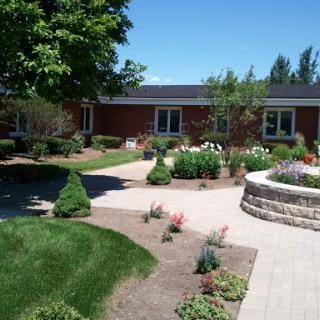 A beautiful outdoor garden area featuring well-maintained landscaping and vibrant flowers.