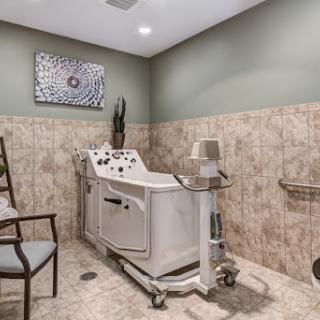 A tranquil spa treatment room featuring specialized medical equipment, designed for relaxation and wellness.