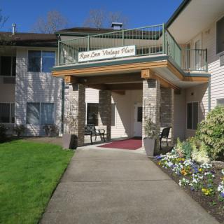 Entrance to a retirement home with well-maintained landscaping.