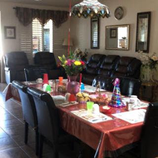 A cozy dining room prepared for a family gathering with a vibrant table setting.