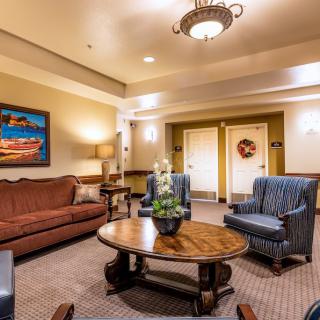 A cozy and well-decorated lobby area with comfortable seating and warm lighting.