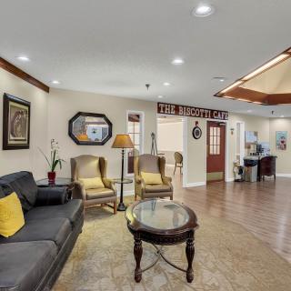 A well-furnished living room with comfortable seating and tasteful decor.