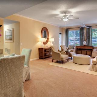 A cozy living room with comfortable seating and elegant decor.