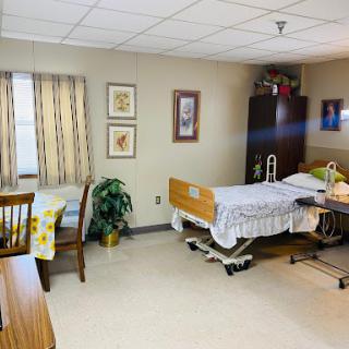 A well-furnished hospital room designed for patient comfort.