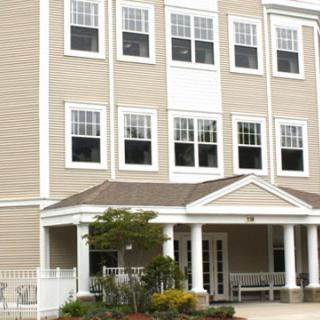 A modern building with large windows and a welcoming entrance.