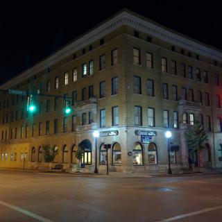 A beautifully lit historic building at night, showcasing urban architecture.