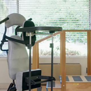A robotic rehabilitation device used for physical therapy in a clinical setting.