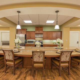 A spacious kitchen and dining area with modern appliances and elegant furnishings.