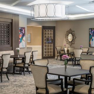 A modern dining area with elegant furniture and decor.