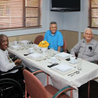 A joyful gathering of friends enjoying a meal together.