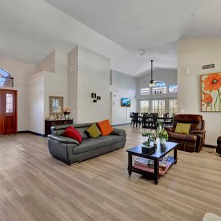 A bright and inviting living room featuring modern furniture and a cozy atmosphere.