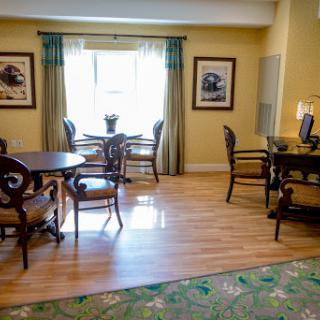 A cozy living space featuring elegant furniture and a warm color scheme.
