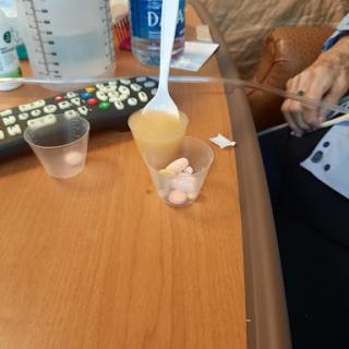 A close-up view of snacks being prepared on a table, possibly in a hospital setting.