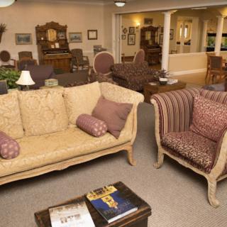 A cozy living room with elegant furniture and warm interior decor.