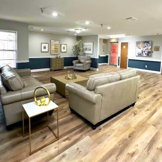 A cozy and modern living room setting featuring comfortable seating and stylish decor.