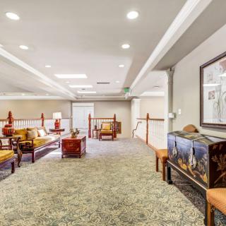 A spacious lobby area with comfortable seating and elegant decor.