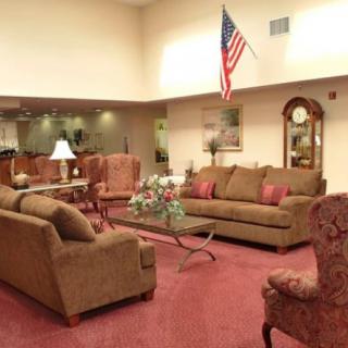 A spacious living room with comfortable seating and tasteful decor.