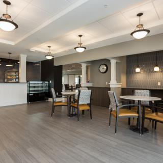 A modern cafe interior with comfortable seating and stylish design.