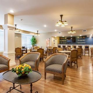 A well-furnished hotel lobby with comfortable seating and elegant decor.