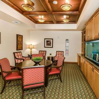 A well-appointed meeting room with a large table, comfortable chairs, and elegant interior decor.