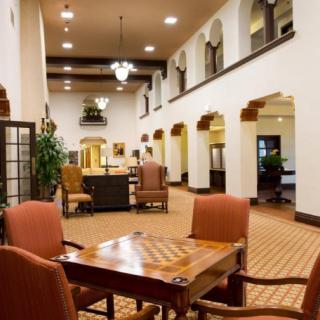 Spacious hotel lobby with comfortable seating and elegant decor.