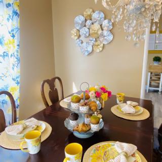 Elegant dining room with tasteful table settings and floral decorations.