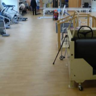 A rehabilitation center with various exercise equipment and facilities for physical therapy.