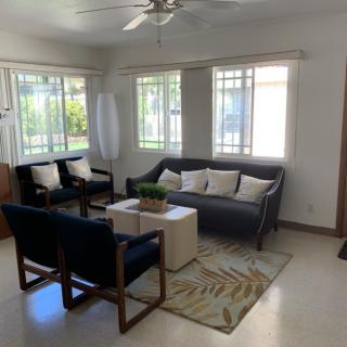 A bright and cozy living room with modern furniture and ample natural light.