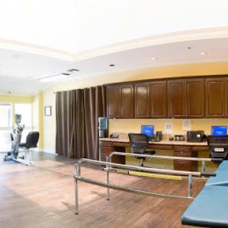 A spacious and well-equipped rehabilitation therapy room designed for patient comfort and effective treatment.