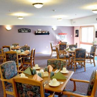 A dining room with neatly arranged tables and chairs, ready for guests.