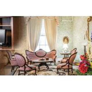A vintage living room with elegant antique furniture and classic decor.