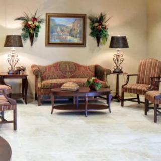 A cozy waiting room with comfortable seating and elegant decor.