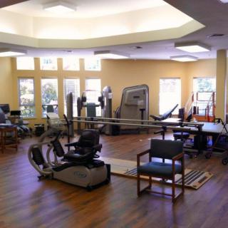 A spacious gym with various exercise equipment for fitness enthusiasts.