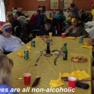 A festive gathering featuring non-alcoholic beverages and colorful masks.