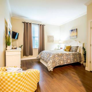 A cozy, modern bedroom with stylish decor and furniture.