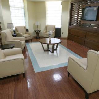 A modern living room with comfortable seating and a central coffee table.