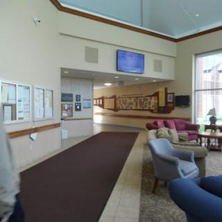 A spacious lobby featuring comfortable seating and modern decor.