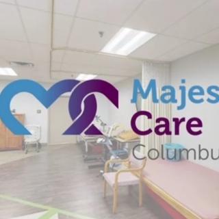 A healthcare clinic interior with the Majestic Care logo visible.