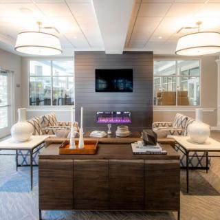 A modern and stylish living room with contemporary furniture and decor.