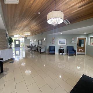 A spacious and modern lobby area featuring elegant seating and stylish lighting.