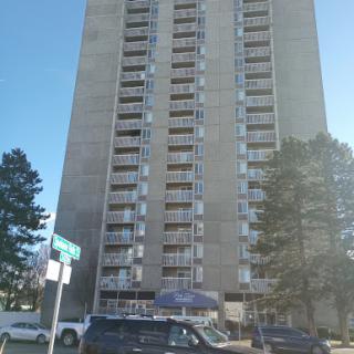 A tall residential building showcasing urban architecture.