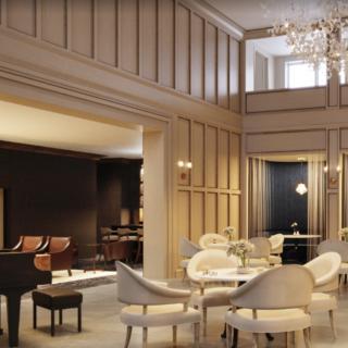 A luxurious living room featuring elegant furniture, a grand piano, and a stunning chandelier.