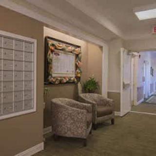 A quiet hallway with seating and decorative elements.