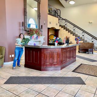 A welcoming hotel lobby featuring a reception desk and stylish decor.